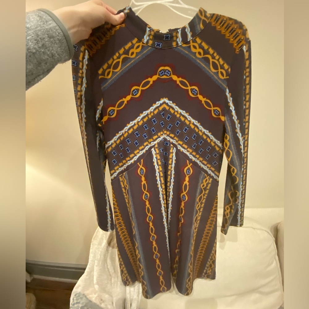 Free people small dress. Base color is purple-ish.